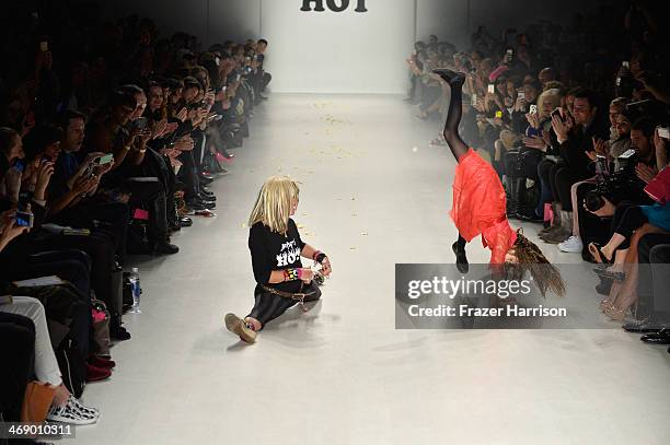 Designer Betsey Johnson and her granddaughter walk the runway at the Betsey Johnson fashion show during Mercedes-Benz Fashion Week Fall 2014 at The...