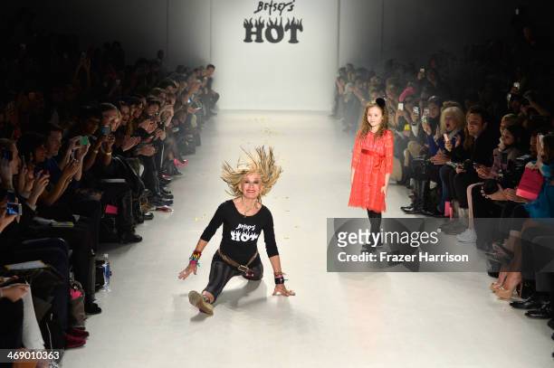 Designer Betsey Johnson and her granddaughter walk the runway at the Betsey Johnson fashion show during Mercedes-Benz Fashion Week Fall 2014 at The...