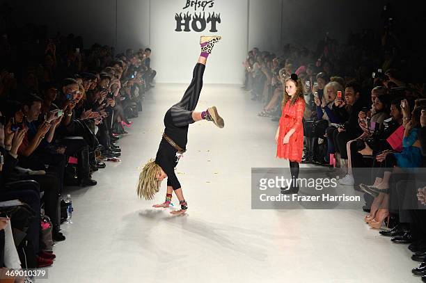Designer Betsey Johnson and her granddaughter walk the runway at the Betsey Johnson fashion show during Mercedes-Benz Fashion Week Fall 2014 at The...