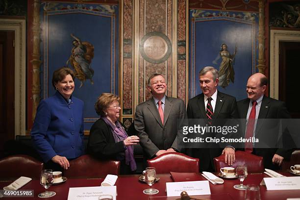 Jordan's King Abdullah II laughs with members of the Appropriations Committee Sen. Jeanne Shaheen , Chairman Barbara Mikulski , Sen. Mike Johanns and...