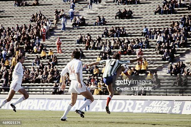 French footballer Claude Papi kicks the ball followed by Hungarian team during the World Cup first round soccer match between France and Hungary, on...