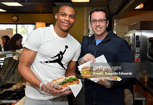 Player Russell Westbrook and Jared Fogle celebrate Westbrook's joining Subway's Famous Fan Roster at Subway Restaurant on February 12, 2014 in Los...