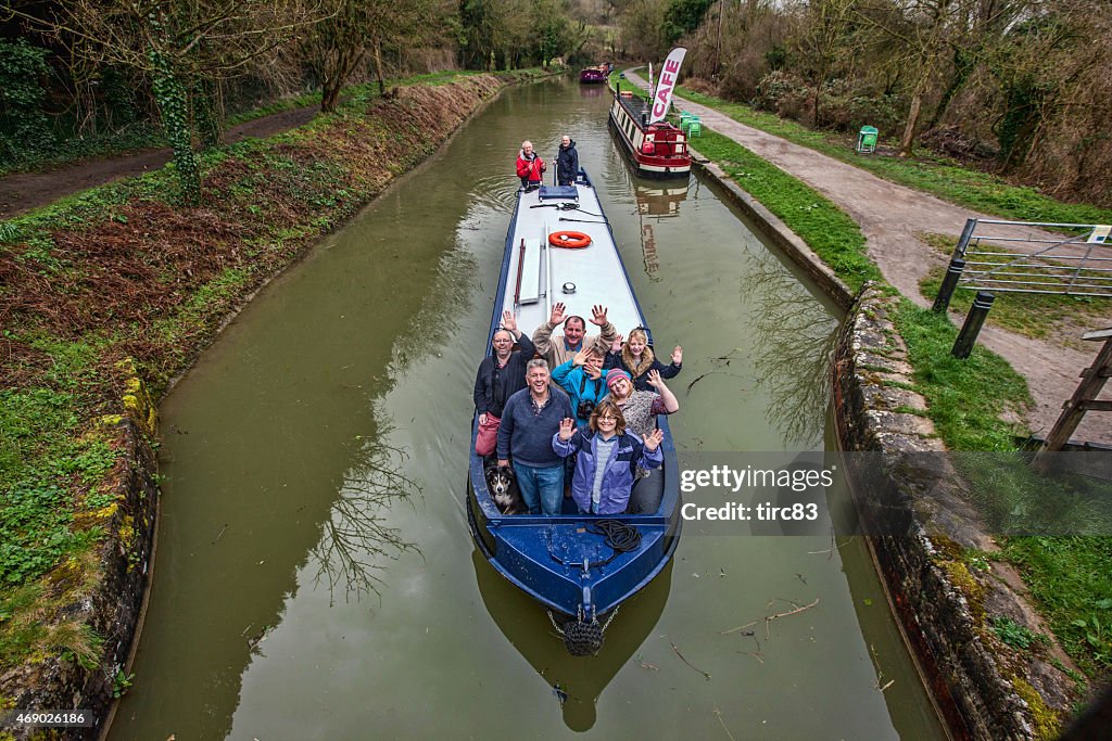 Group of people aboard canal barge on holiday