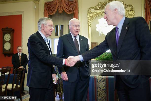 Senate Majority Leader Harry Reid , Sen. Patrick Leahy and Sen. John Cornyn wait for the arrival of Jordan's King Abdullah II at the U.S. Capitol...