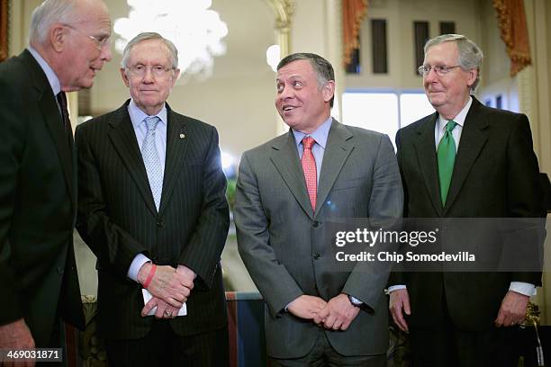 Jordan's King Abdullah II poses for photographs with Sen. Patrick Leahy , Senate Majority Leader Harry Reid and Senate Minority Leader Mitch...