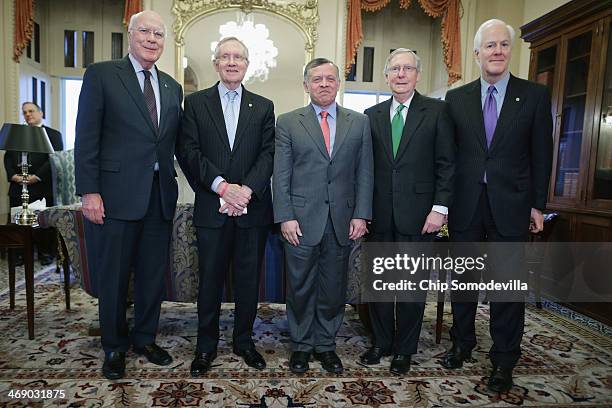 Jordan's King Abdullah II poses for photographs with Sen. Patrick Leahy , Senate Majority Leader Harry Reid , Senate Minority Leader Mitch McConnell...