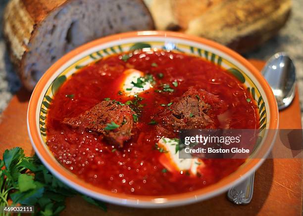 Olga Lisovskaya and her homemade borscht, with a fresh loaf of bread her husband made.