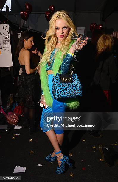 Model prepares backstage at the Marist College Presents Betsey Johnson Reprise fashion show during Mercedes-Benz Fashion Week Fall 2014 at The Salon...