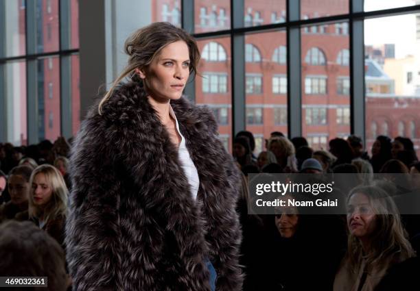 Model walks the runway at the Michael Kors Show during Mercedes-Benz Fashion Week Fall 2014 at Spring Studios on February 12, 2014 in New York City.