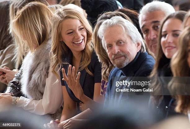 Blake Lively and Michael Douglas attend the Michael Kors Show during Mercedes-Benz Fashion Week Fall 2014 at Spring Studios on February 12, 2014 in...