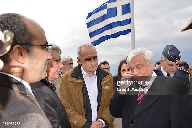Greece's President Prokopis Pavlopoulos speaks on the phone with Turkey's President Recep Tayyip Erdogan as he visits the Greek soldiers to celebrate...