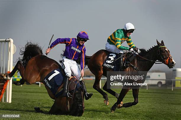 Arctic Fire ridden by Ruby Walsh falls at the last as Jezki ridden by Tony McCoy lands ahead of them to go on and win the Doom Bar Aintree Hurdle at...