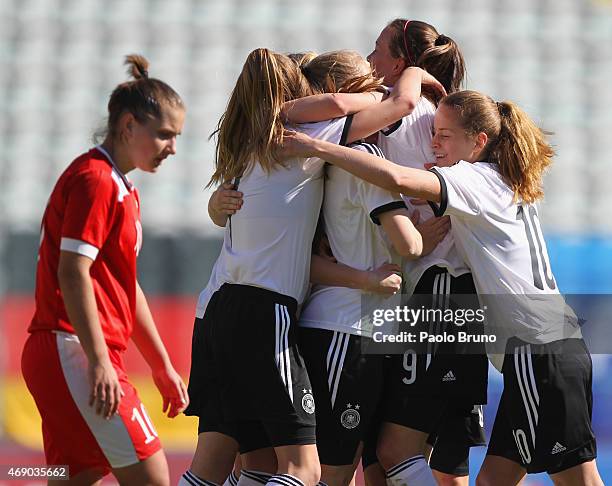 Stefanie Sanders of Germany with her teammates celebrate after scoring the opening goal during the UEFA Under17 women's Elite Round match between U17...