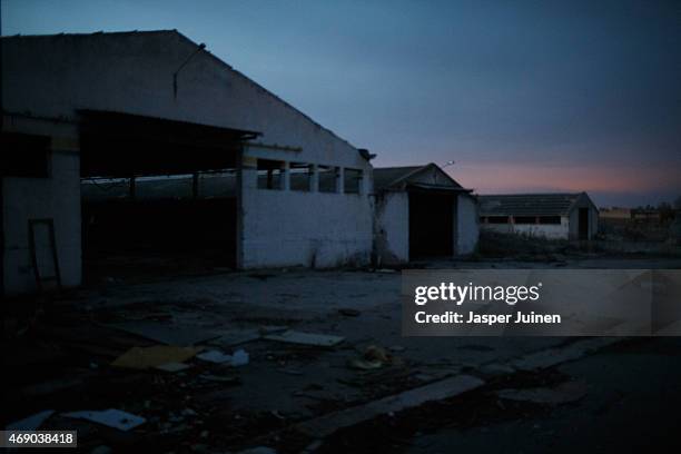 The desolate and redundant Puertas Mavisa door factory stands closed on December 20 in Villacanas,, Spain. Everything is different now from seven...