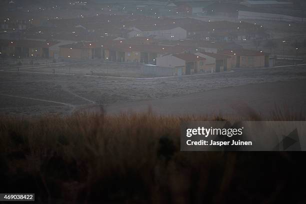 Streetlights are lit on December 22 in Villacanas,, Spain, where everything is different now from seven years ago when the small town was part of...