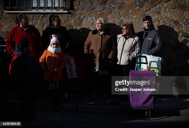 People queue up for the Caritas food hand-out, on which they largely depend, on December 23 in Villacanas,, Spain, where everything is different now...