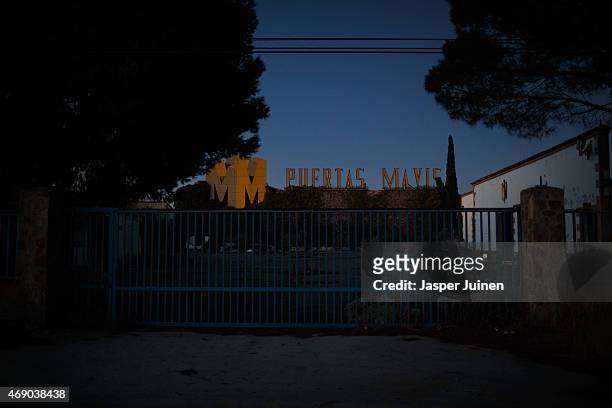 The entry gate of the desolate and redundant Puertas Mavisa door factory stands closed on December 20 in Villacanas,, Spain. Everything is different...