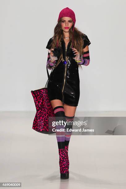 Model walks the runway at Betsey Johnson during Mercedes-Benz Fashion Week Fall 2014 at The Salon at Lincoln Center on February 12, 2014 in New York...