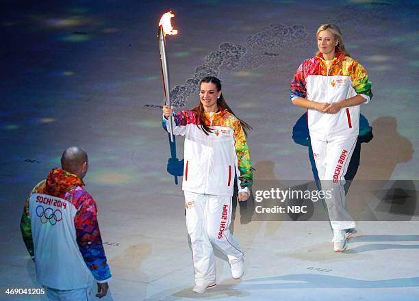 Opening Ceremony" -- Pictured: Torchbearers Alexander Karelin, Elena Isinbaeva, Maria Sharapova during the opening ceremony of the 2014 Sochi Winter...