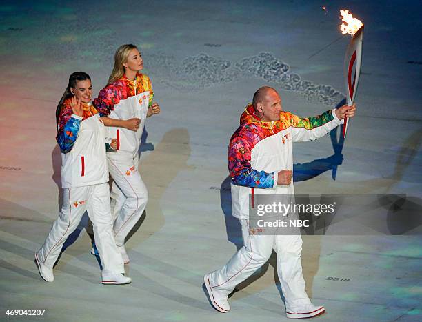 Opening Ceremony" -- Pictured: Torchbearers Elena Isinbaeva, Maria Sharapova, Alexander Karelin, during the opening ceremony of the 2014 Sochi Winter...