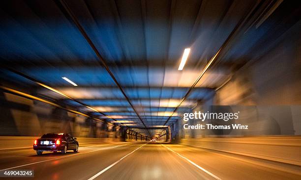 driving in a tunnel at night - tunnel stock pictures, royalty-free photos & images