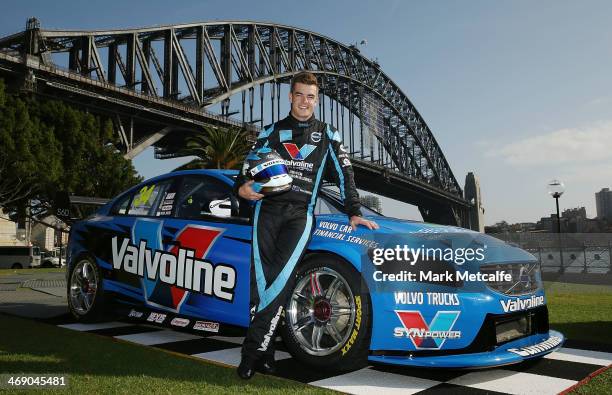 Driver Scott McLaughlin poses in front of the Volvo S60 race car and the Sydney Harbour Bridge during the Volvo Polestar Racing 2014 V8 Supercar...