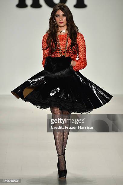 Model walks the runway at the Marist College Presents Betsey Johnson Reprise fashion show during Mercedes-Benz Fashion Week Fall 2014 at The Salon at...