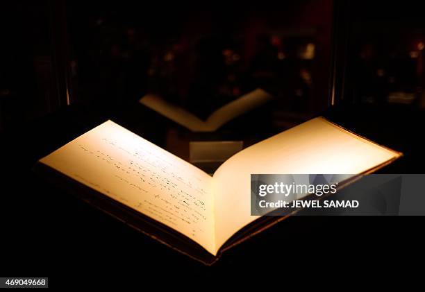 Handwritten manuscript belonging to British mathematician and code breaker Alan Turing is displayed during a press preview in New York on April 9,...