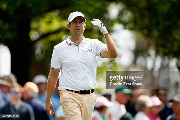 Erik Compton of the United States walks off after hitting his tee shot on the fourth hole during the first round of the 2015 Masters Tournament at...