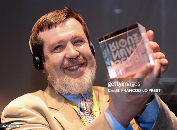 The Russian creator of the video game Tetris, Alexey Pajitnov, holds on April 9, 2015 the Digital Greenhouse trophy during the inauguration of 17,000...