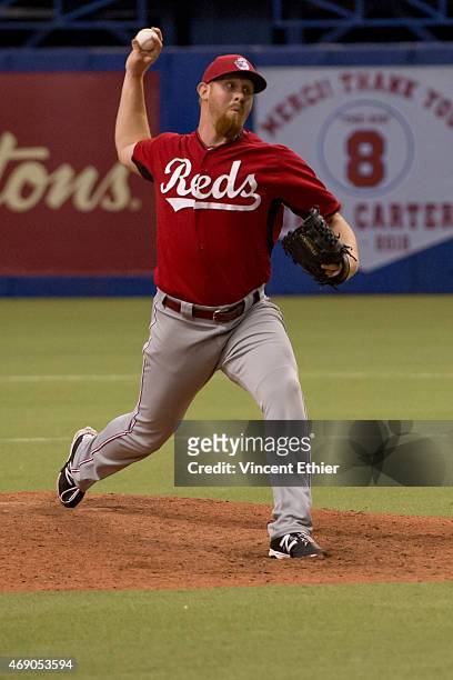 Nate Adcock of the Cincinnati Reds pitches during the exhibition game against the Toronto Blue Jays at Olympic Stadium on Friday, April 3, 2015 in...