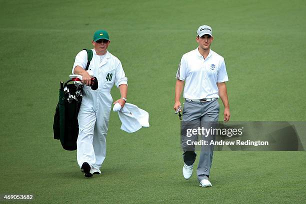 Bradley Neil of Scotland and caddie Philip McKenna walk up the second hole fairway during the first round of the 2015 Masters Tournament at Augusta...