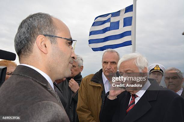 Greece's President Prokopis Pavlopoulos speaks on the phone with Turkey's President Recep Tayyip Erdogan as he visits the Greek soldiers to celebrate...