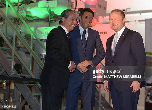 Italian Prime Minister Matteo Renzi , his Maltese counterpart Joseph Muscat and former Maltese Prime Minister Lawrence Gonzi smile on April 9, 2015...