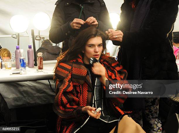 Model prepares backstage at the Nanette Lepore Show during Mercedes-Benz Fashion Week Fall 2014 at The Salon at Lincoln Center on February 12, 2014...
