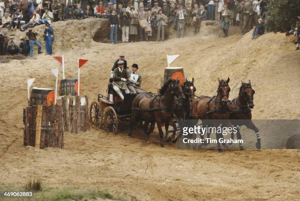 Prince Philip, Duke of Edinburgh takes part in the World Carriage Driving Championships in Windsor, UK, 1980. Here he negotiates the sand pit during...