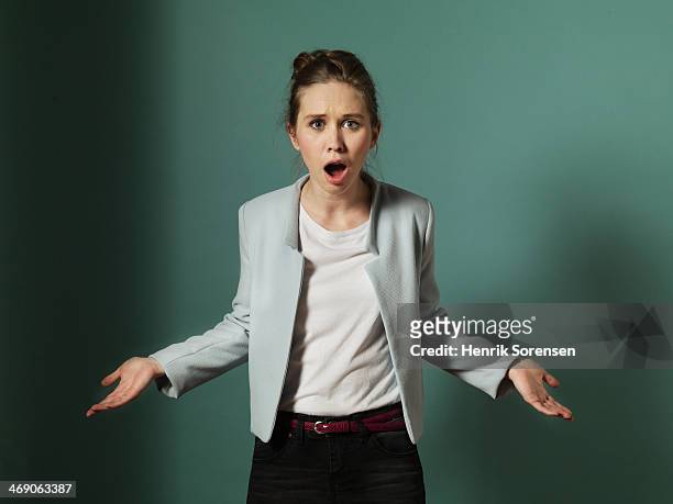 portrait of a young woman - shocked stock-fotos und bilder