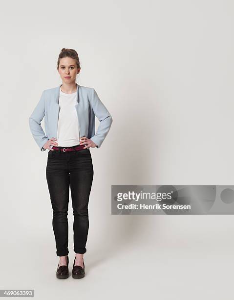 full-length portrait of a young woman - white trousers stockfoto's en -beelden