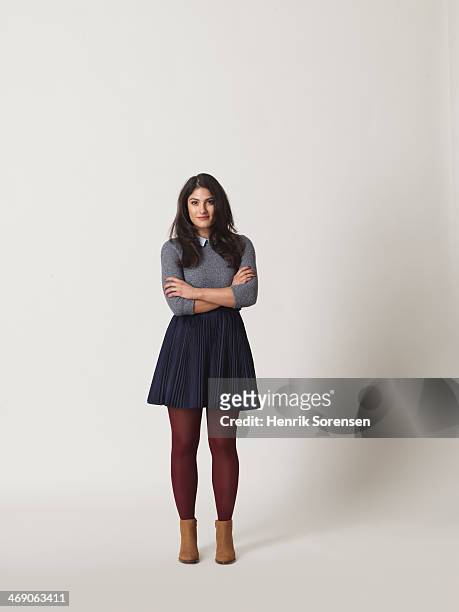 full-length portrait of a young woman - gray skirt stock-fotos und bilder