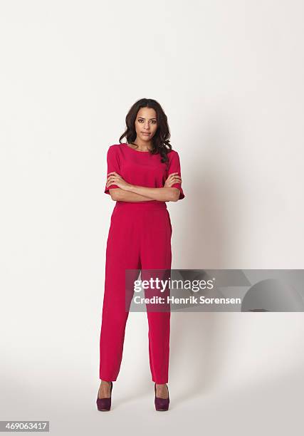 full-length portrait of a young woman - pink jumpsuit foto e immagini stock