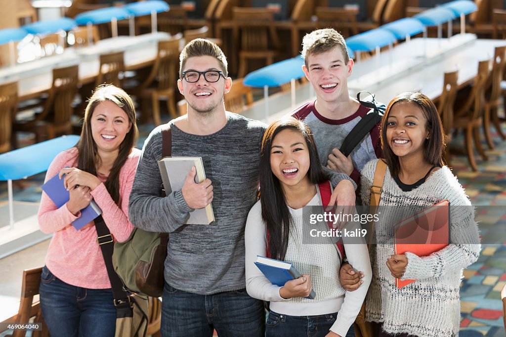 Group of multiracial teenage students in the library