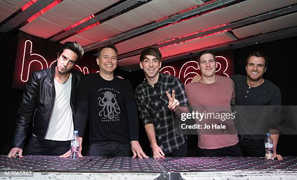 Rian Dawson, Jack Barakat, Alex Gaskarth and Zack Merrick of All Time Low with their guest Mark Hoppas of Blink 182 sign copies of their New Album...