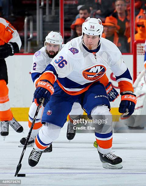 Eric Boulton of the New York Islanders takes the puck in the third period against the Philadelphia Flyers on April 7, 2015 at the Wells Fargo Center...