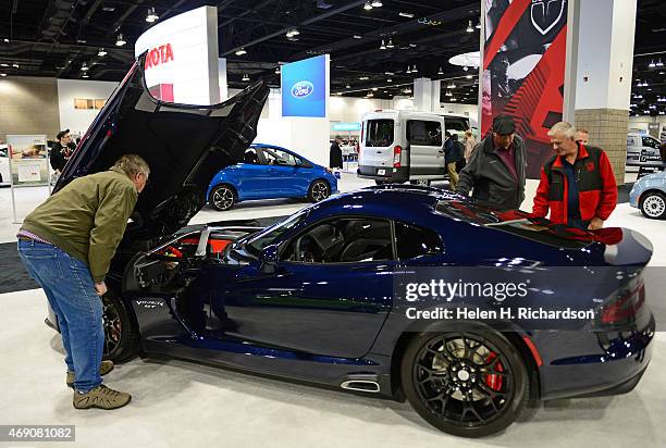 People look at the 2015 Dodge Viper GT, MSRP $103,785 at the Denver Auto Show in Denver, Colorado on April 9, 2015. The show has over 500 cars and 40...