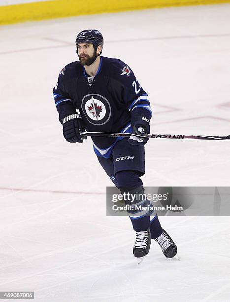 Jay Harrison of the Winnipeg Jets skates down the ice during third-period action in an NHL game against the Vancouver Canucks at the MTS Centre on...