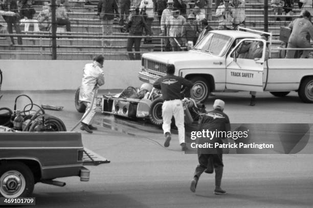 Emergency crews rush to the aid of American driver Art Pollard whose fatal crash occurred during a practice race for the Indianapolis 500,...