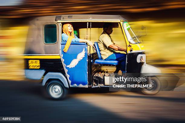 woman riding a tuk tuk taxi - rickshaw or tuk tuk or surrey or pedicab stock pictures, royalty-free photos & images