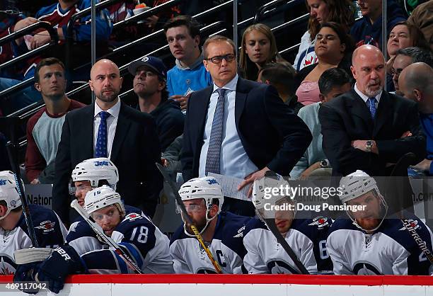 Assistant coach Pascal Vincent, head coach Paul Maurice and assistant coach Charlie Huddy and the Winnipeg Jets look from the bench against the...