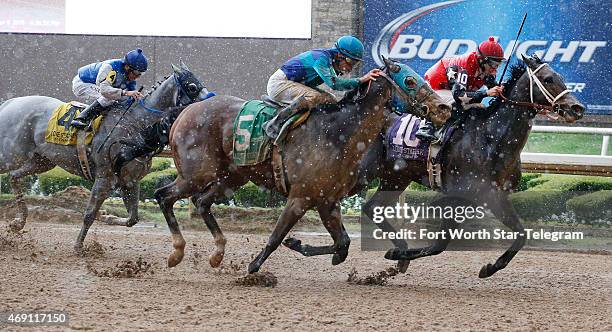 Wagson, with Lindey Wade up, right, leads Solar Charge, with Gerardo Mora up, and Russell Baze aboard He's a Bling in the opening race of the Spring...