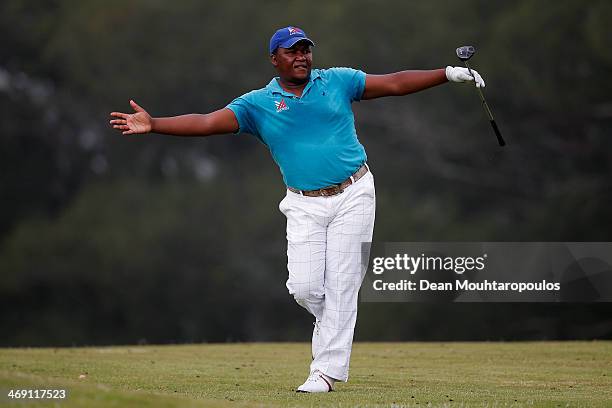 James Kamte of South Africa reacts after he hits his second shot on the 15th hole during Day 1 of the Africa Open at East London Golf Club on...